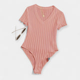 "Body avec Détails en Tubes" could be rewritten as "Body Élégant avec Accents en Tubes".