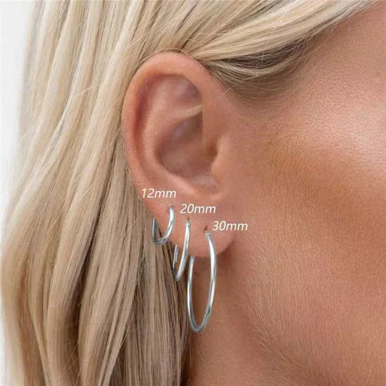 Sabina – Boucles d'oreilles en or au design éclatant.