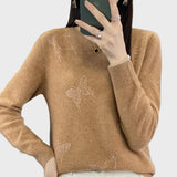 Col roulé à motif de papillons