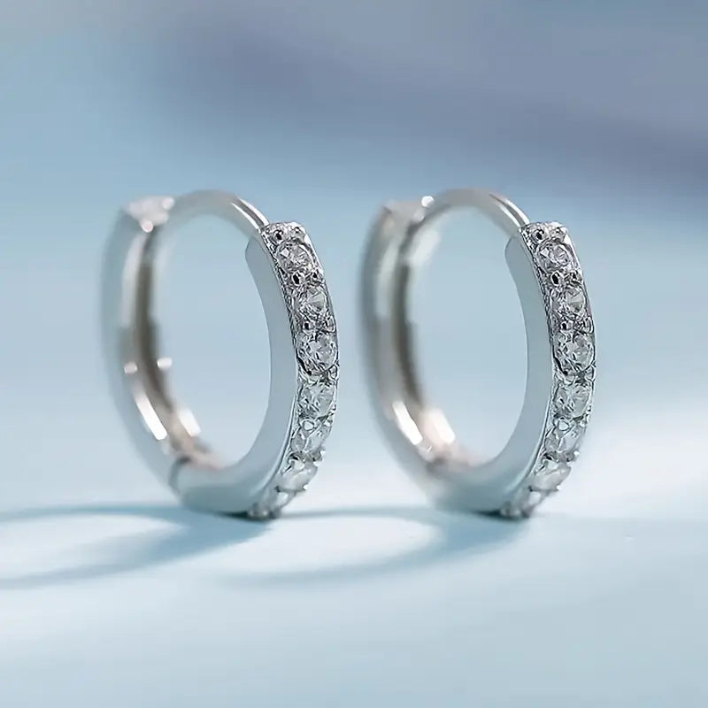 Nora – Boucles d'oreilles en or ornées de pierres délicates.